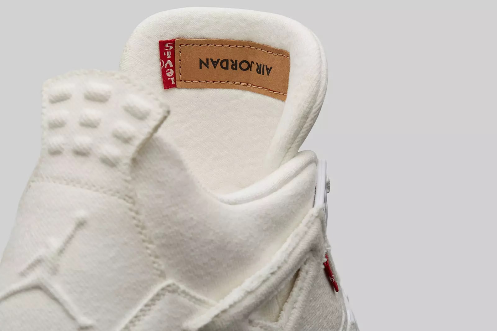 White levis hot sale jordan 4