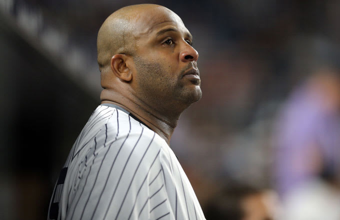 Yankess pitcher CC Sabathia stands in the dugout during a 2017 game.