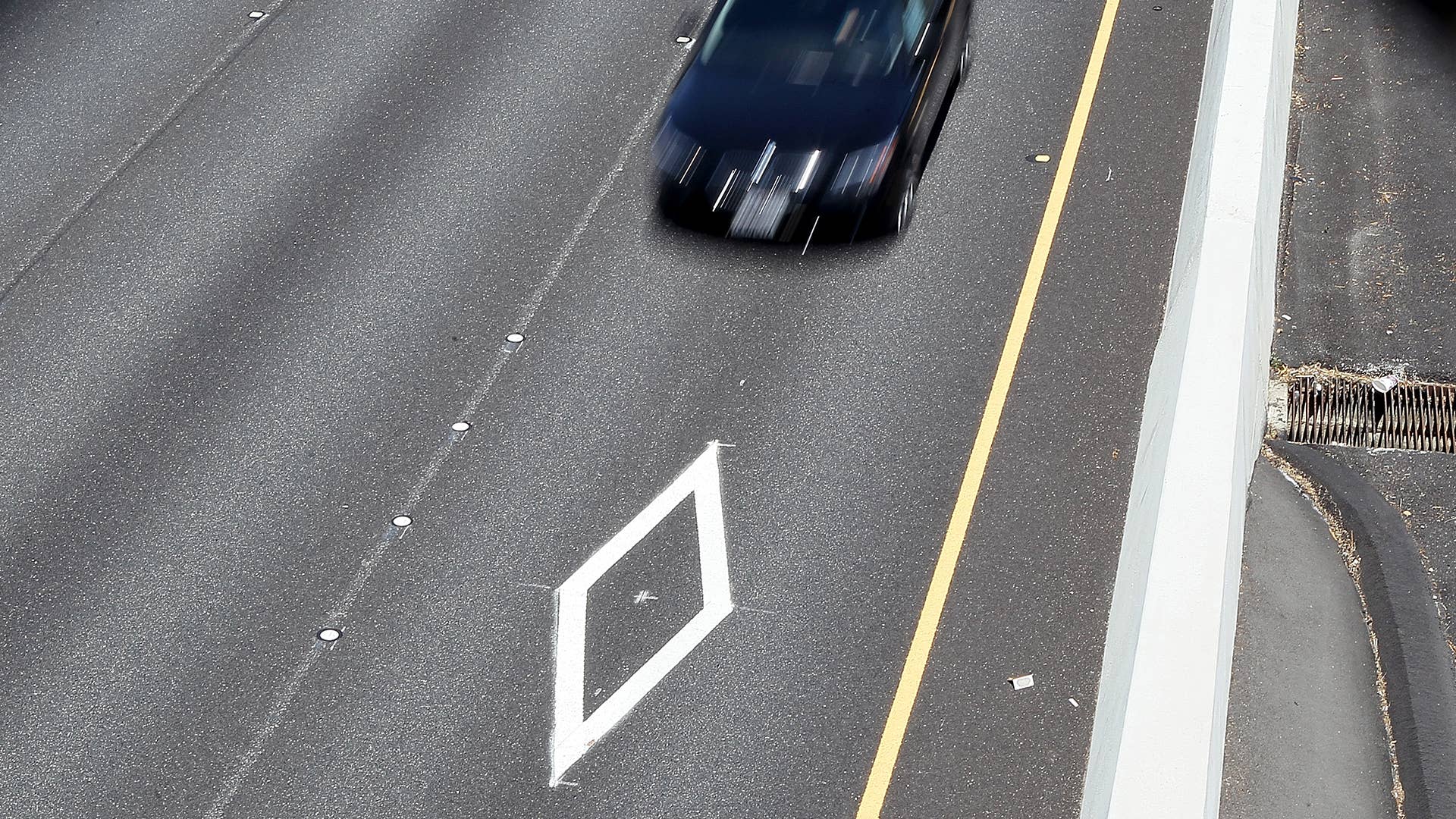 A car drives in the carpool lane on highway 101 on May 6, 2011