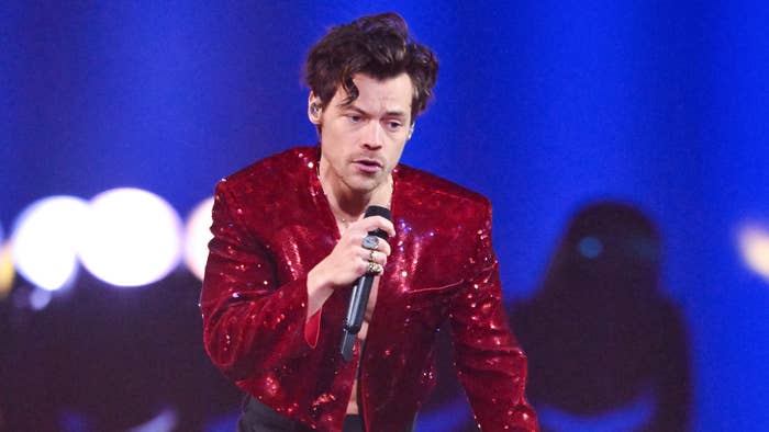Harry Styles performs live on stage during The BRIT Awards 2023