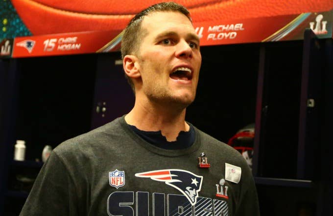 Tom Brady looks for his Super Bowl LI jersey in the locker room.