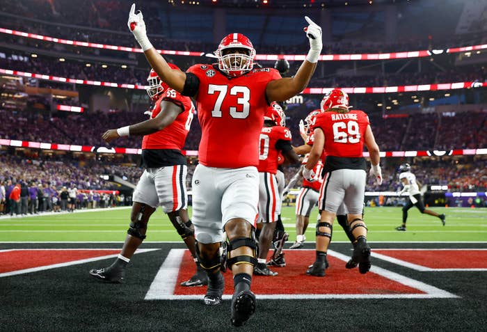 UGA player Xavier Truss celebrates after his team scores a touchdown.
