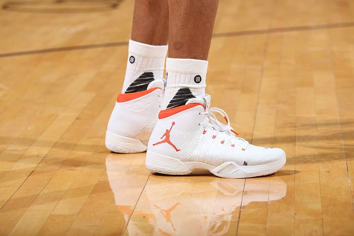 Russell Westbrook Wearing a White/Orange Air Jordan 31 PE Shoes