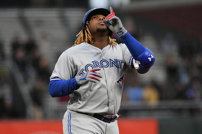 Vladimir Guerrero Jr. #27 of the Toronto Blue Jays reacts after hitting a single in the second inning of their MLB game at Oracle Park on May 14, 2019 in San Francisco, California.
