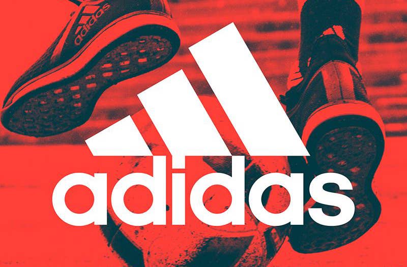 Adidas logo in front of sneakers