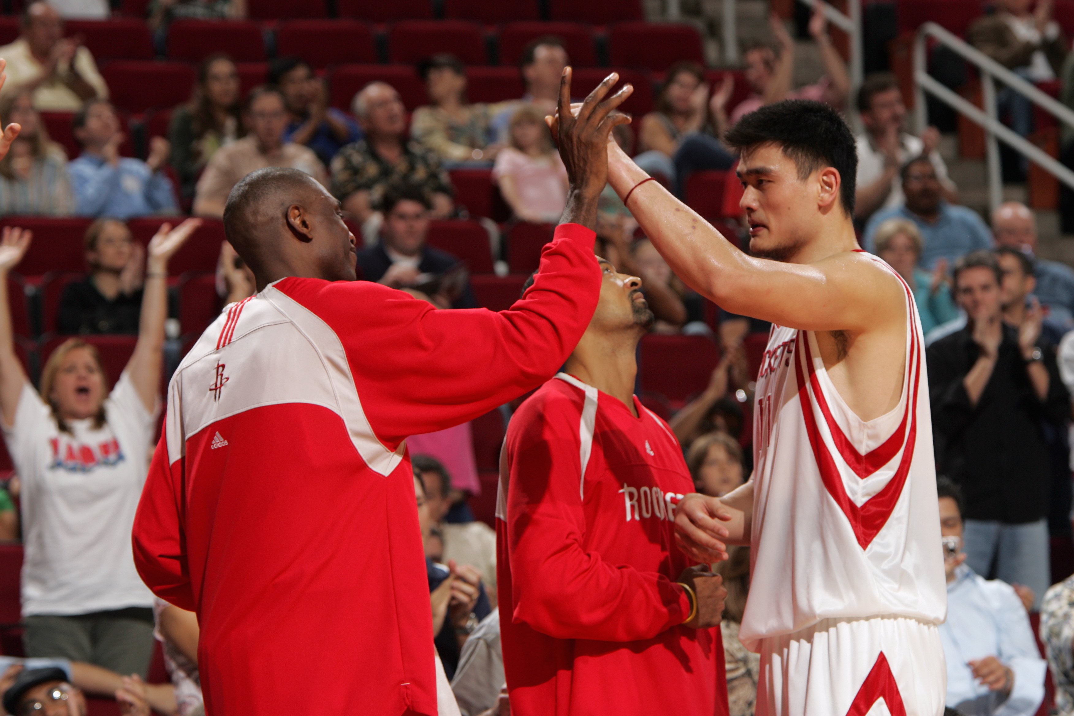 This is a photo of Dikembe Mutombo and Yao Ming
