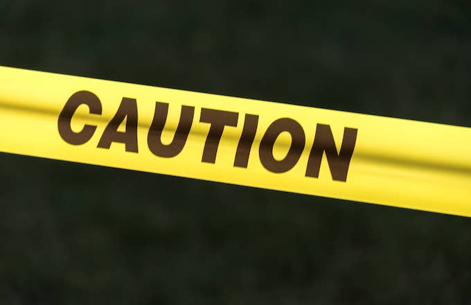 Caution sign: Caution sign tape against black background concept of warning and danger.