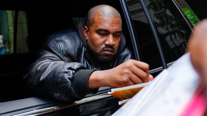 Kanye West arrives at the Balenciaga show