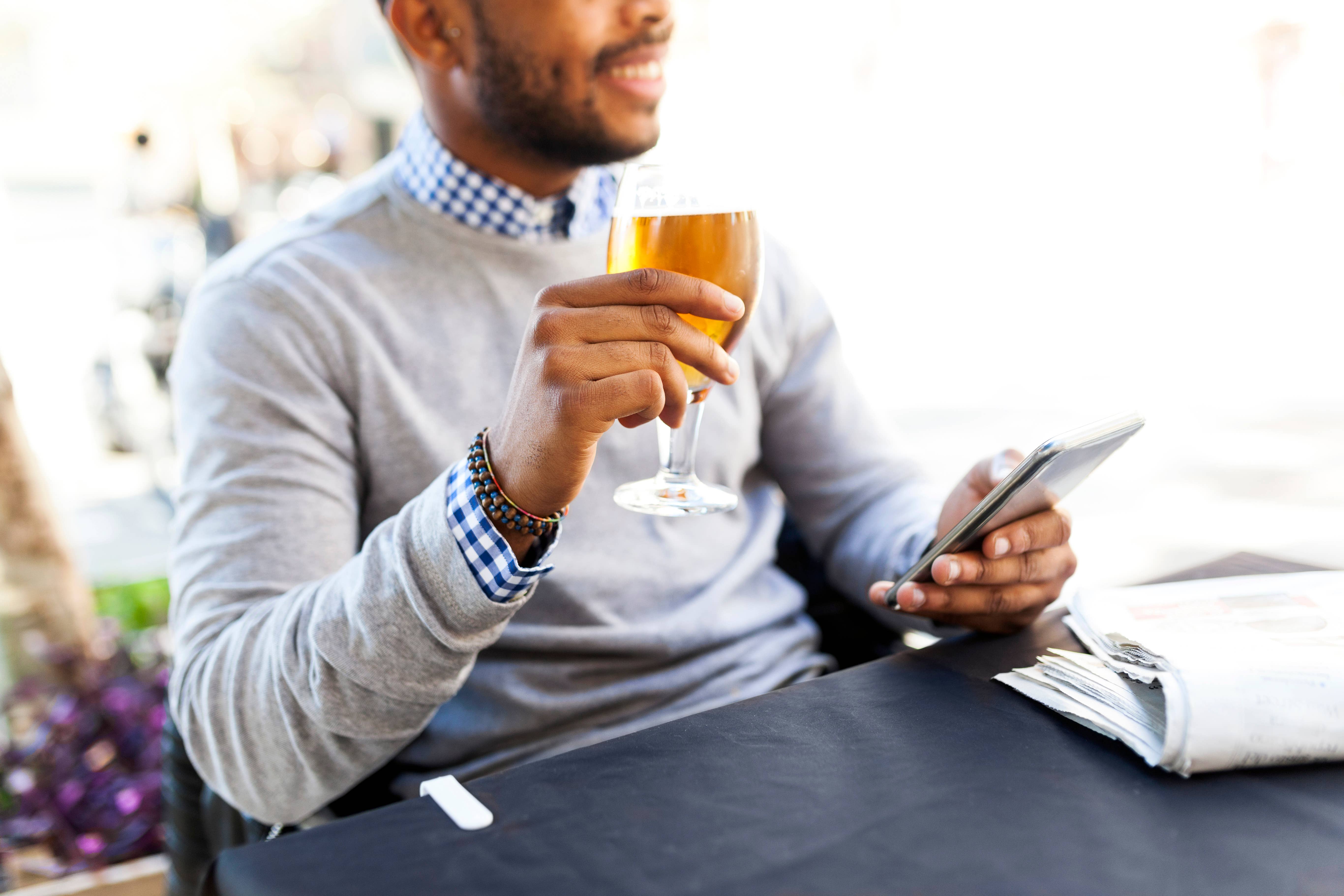 Man with beer and phone