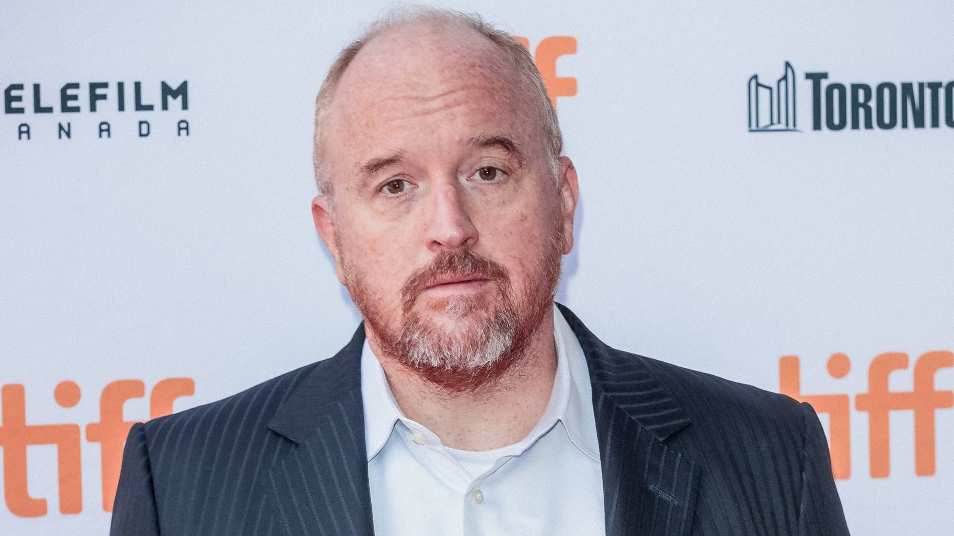 Louis CK is pictured on a red carpet for an event