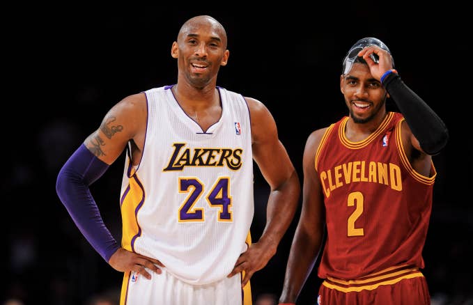 Kobe Bryant #24 of the Los Angeles Lakers and Kyrie Irving