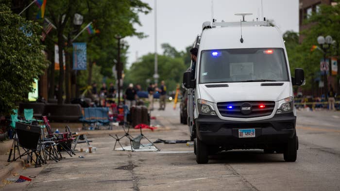 First responders work the scene of a mass shooting at a Fourth of July parade.