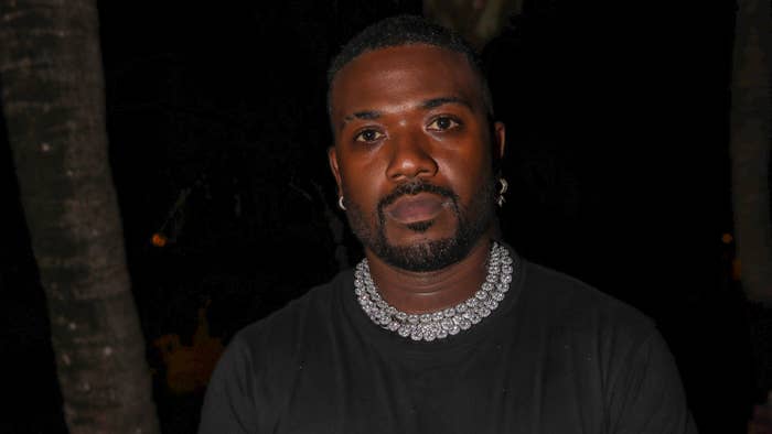 Ray J poses for photo outside an event.