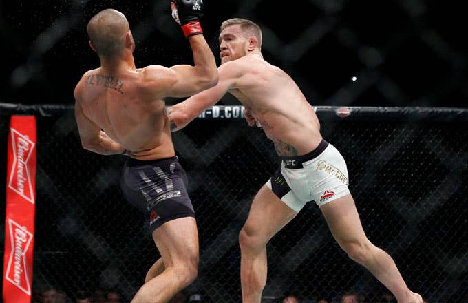 Conor McGregor fights Eddie Alvarez in their lightweight title bout during UFC 205.