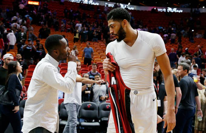Anthony Davis #23 of the New Orleans Pelicans (left) talks with his agent Rich Paul