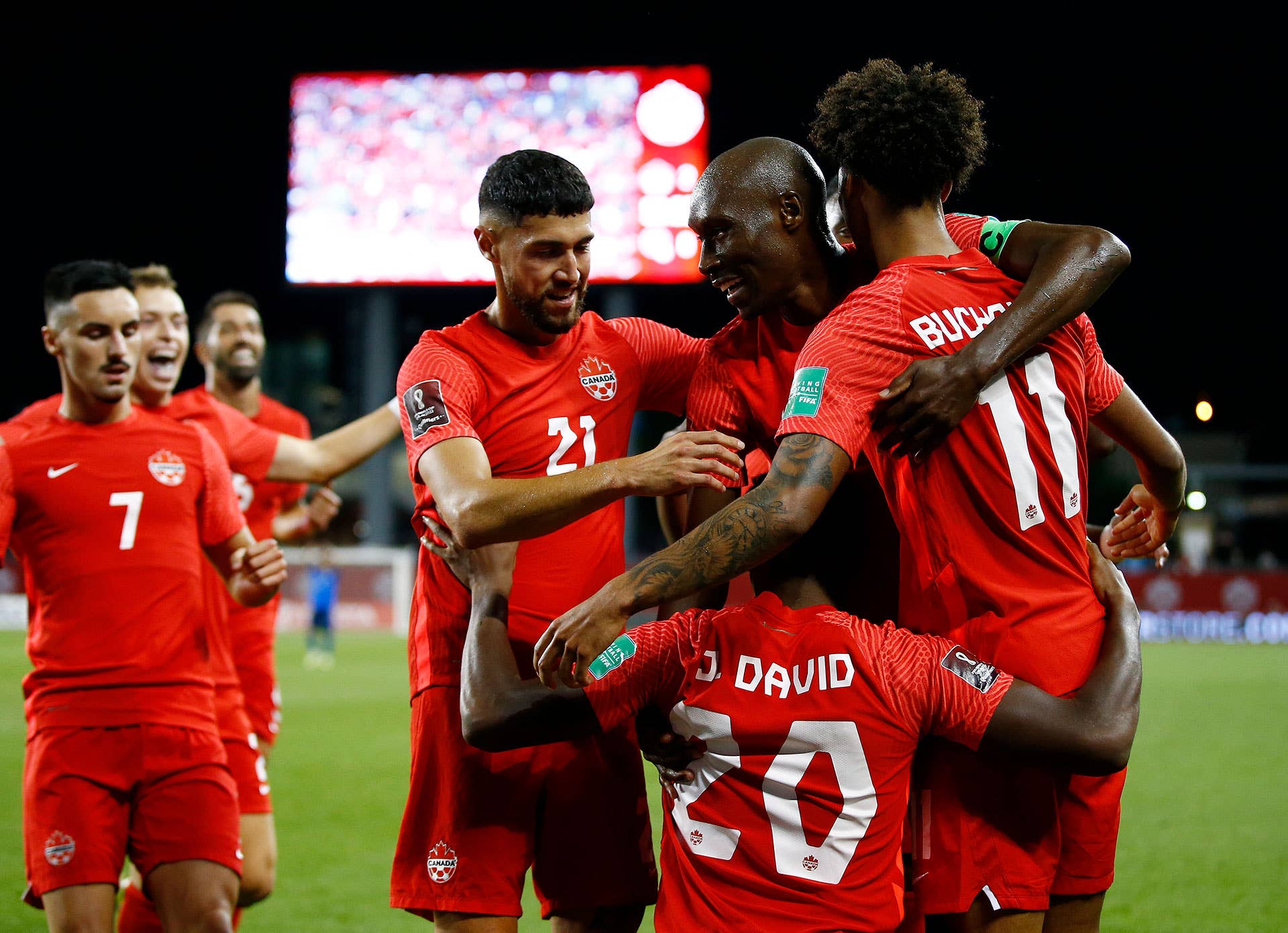 Tajon Buchanan #11 of Canada celebrates with teammates