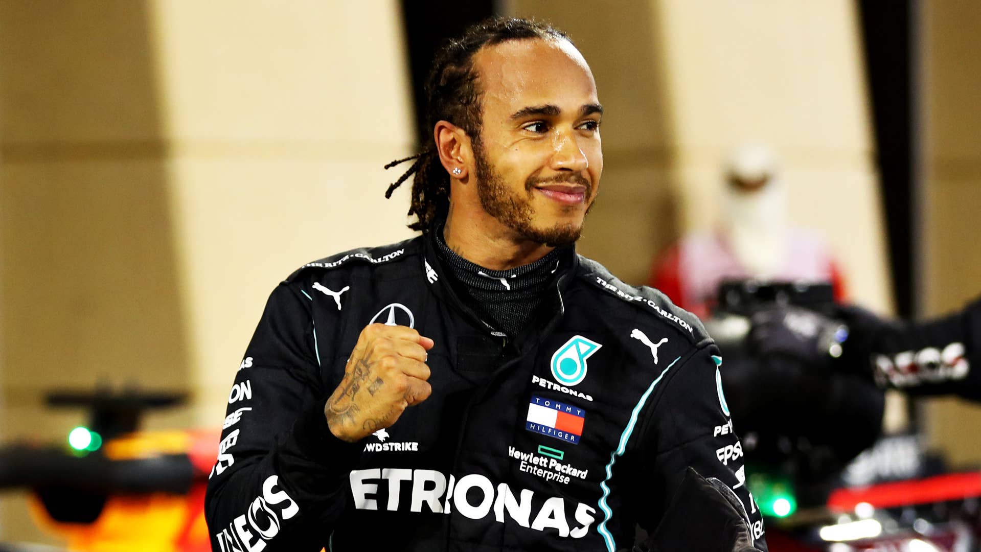 Lewis Hamilton celebrates F1 Grand Prix victory with a fist pump.