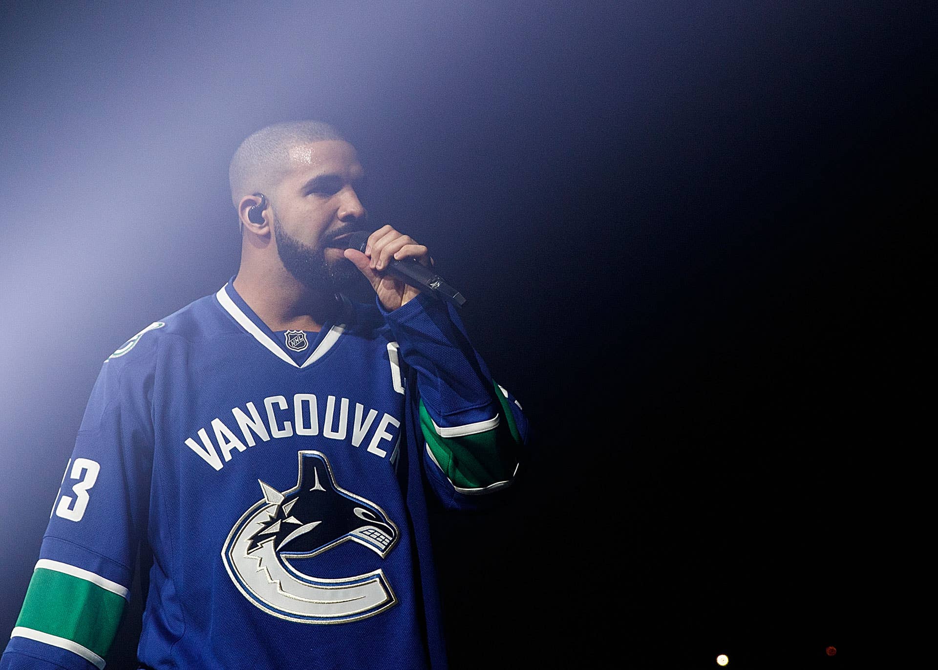 Drake performing in Vancouver wearing Canucks jersey