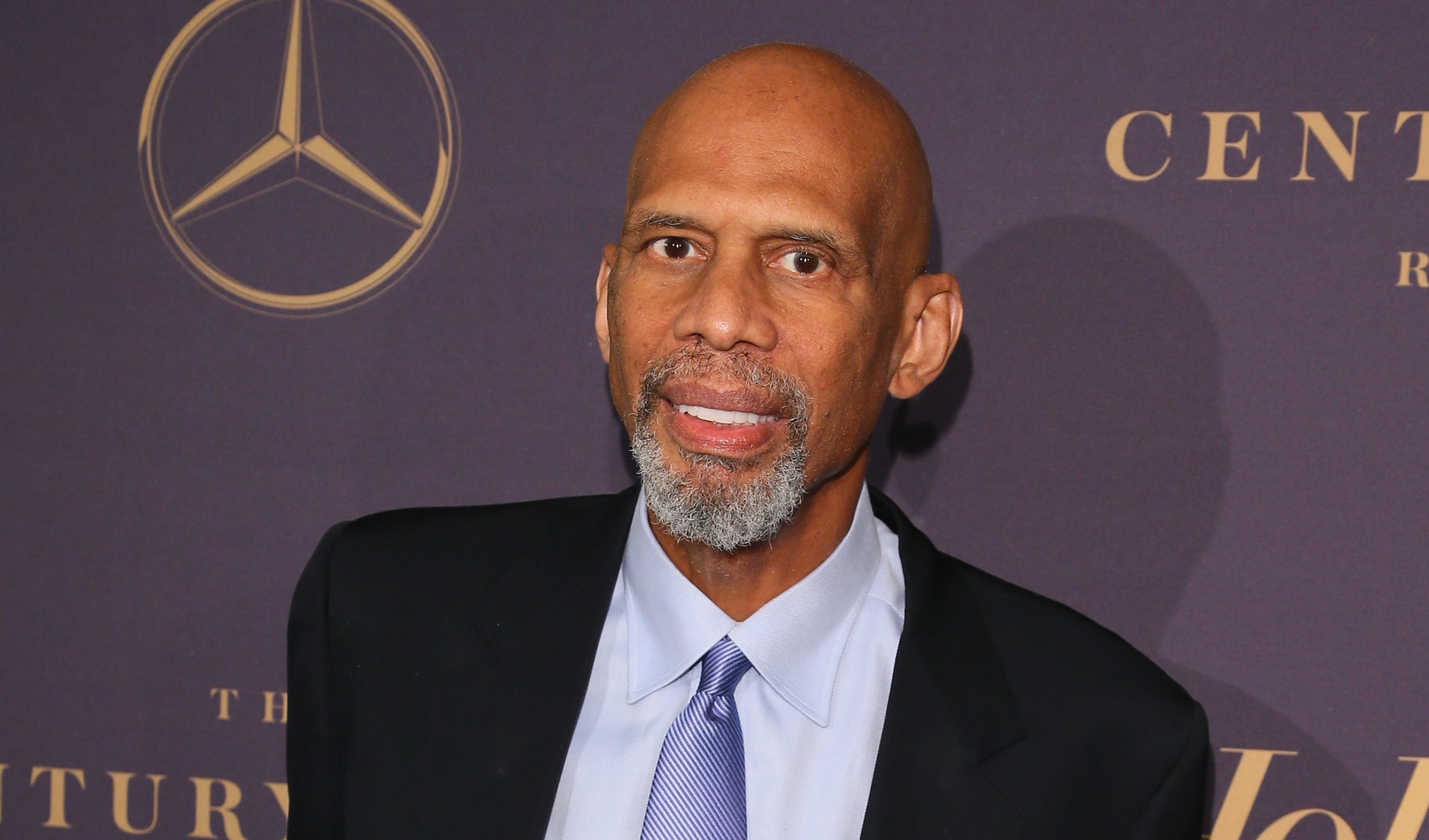 Legend, Kareem Abdul-Jabbar poses for a photo next to the Louis News  Photo - Getty Images