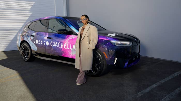 Doja Cat is seen leaning against a custom BMW