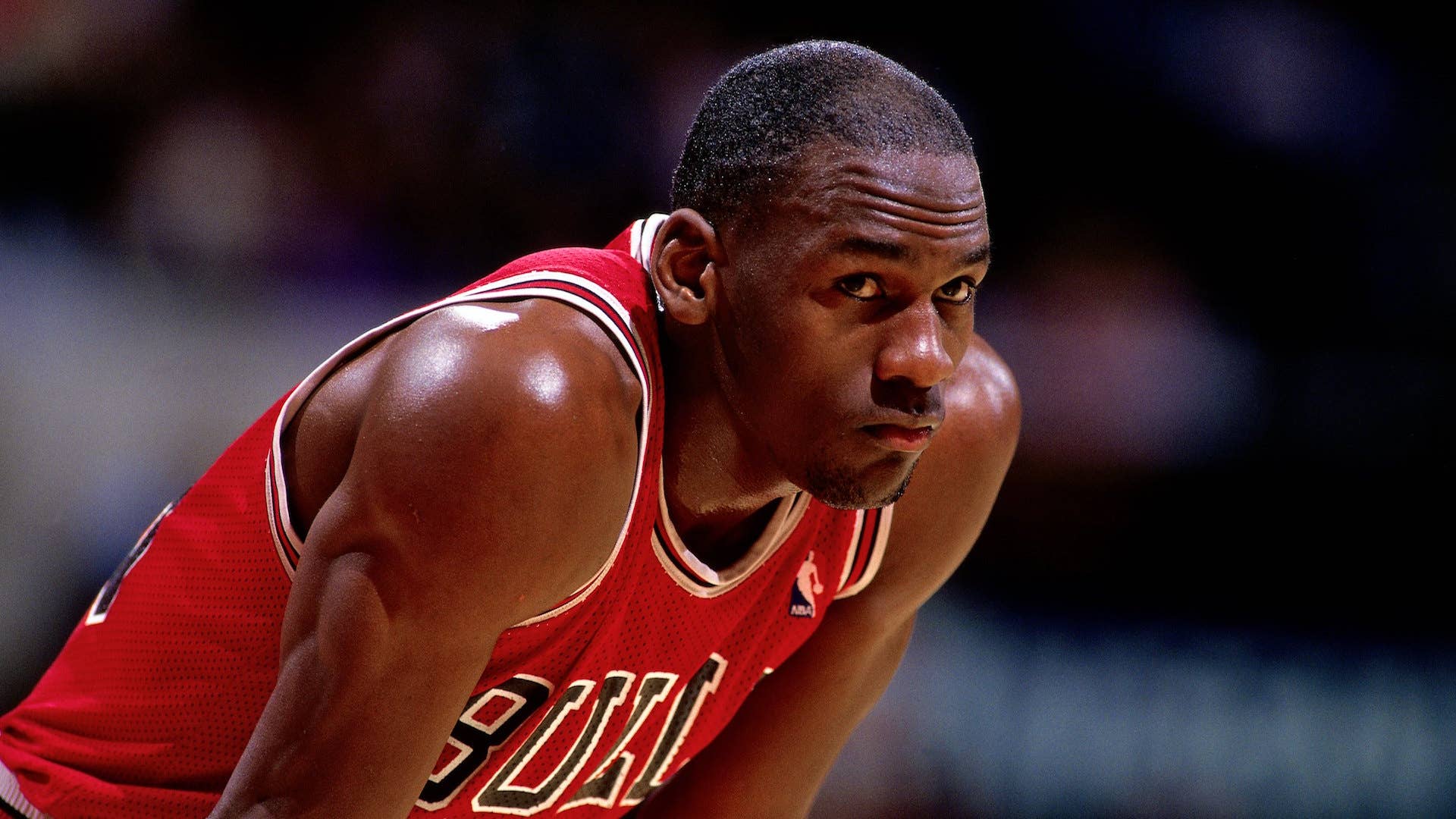 Michael Jordan #23 of the Chicago Bulls looks on durng a NBA game.