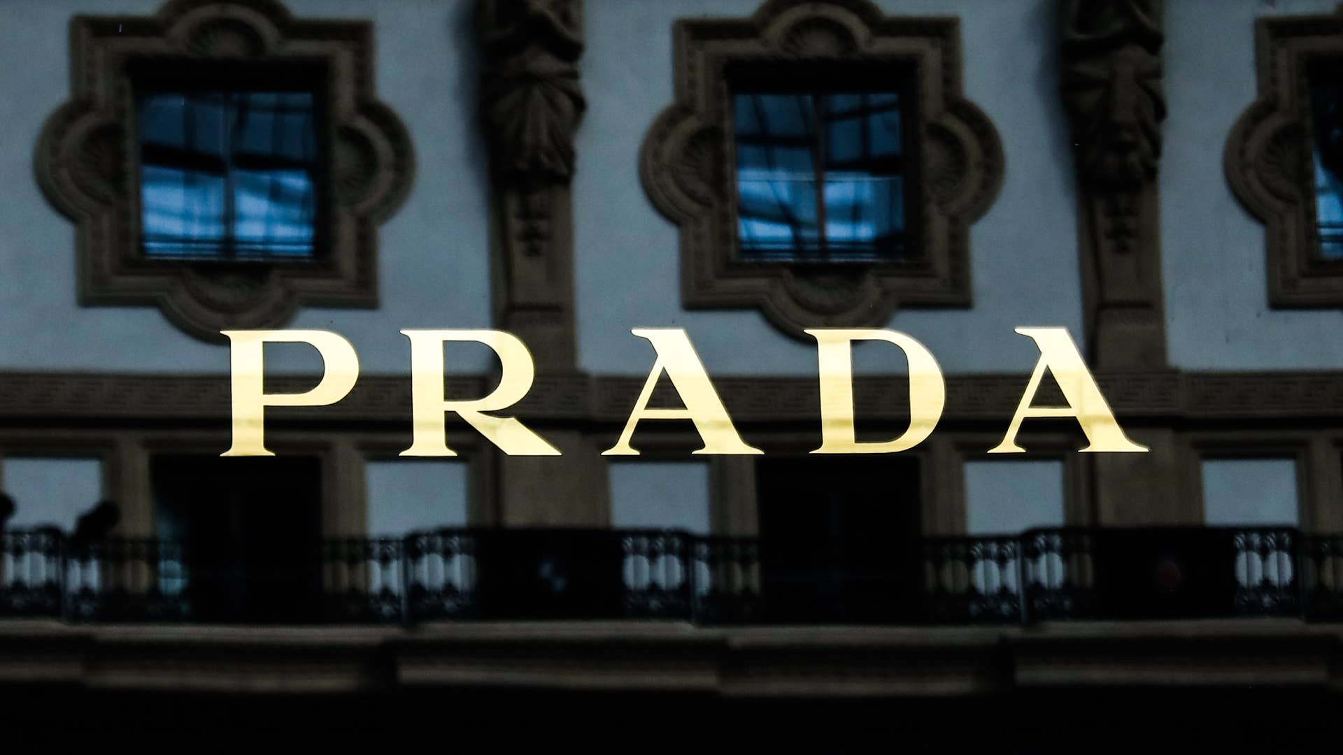 A logo for the Prada brand is pictured