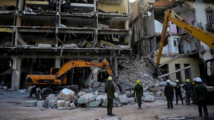 Rescuers remove debris from the ruins of the Saratoga Hotel, in Havana, on May 7, 2022