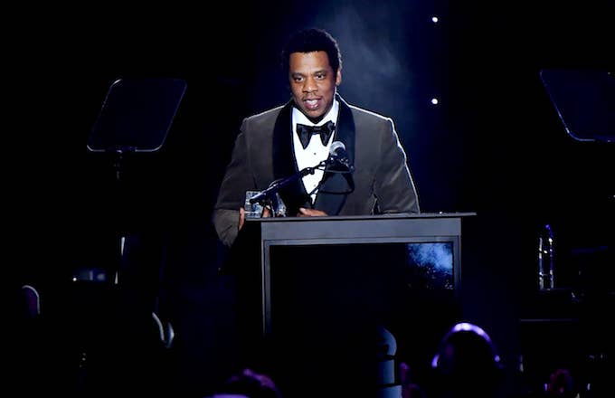 Jay Z accepts the President's Merit Award onstage.