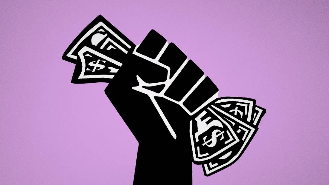 Black power fist holding money
