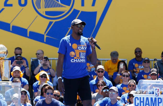 Kevin Durant takes the stage during the Warriors' championship celebration.
