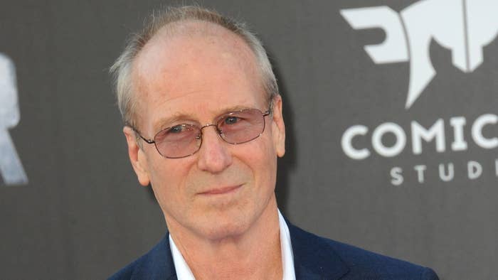 William Hurt arrives for photos at movie premiere.