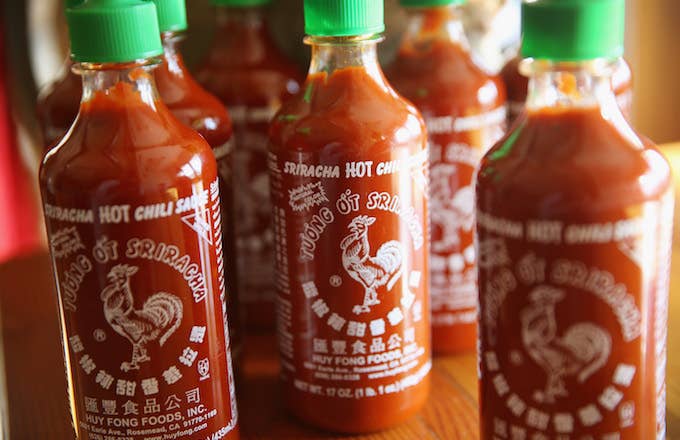 Bottles of Sriracha hot chili sauce are shown.