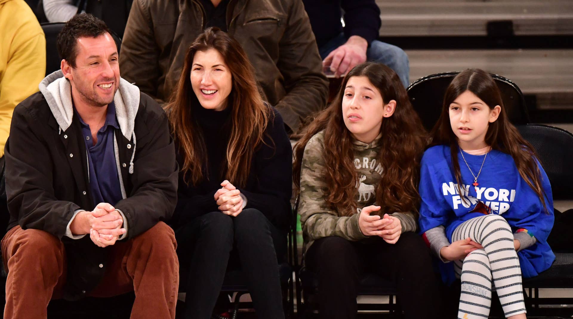 Adam Sandler, his wife, and two daughters at New York Knicks game