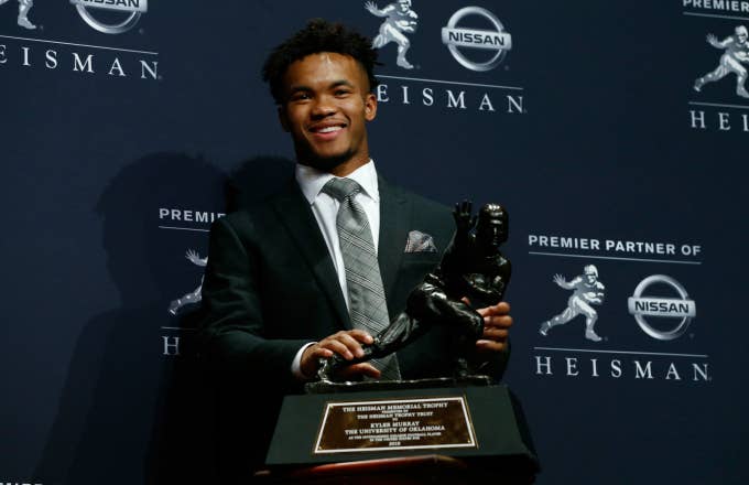 Kyler Murray poses for a photo after winning the 2018 Heisman Trophy