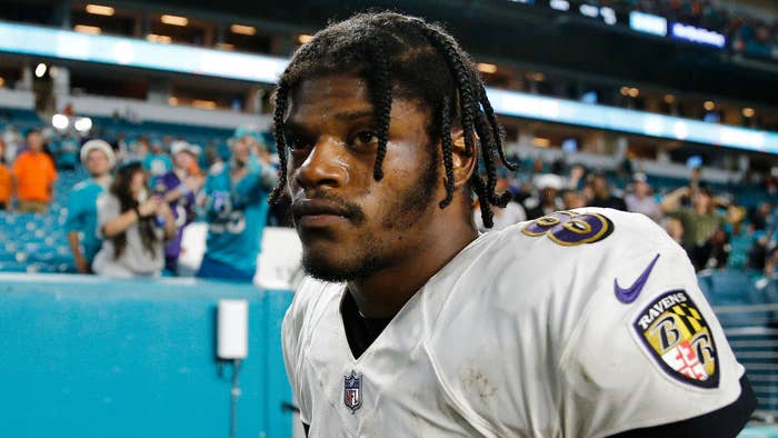 Lamar Jackson walks off the field after losing to the Miami Dolphins.