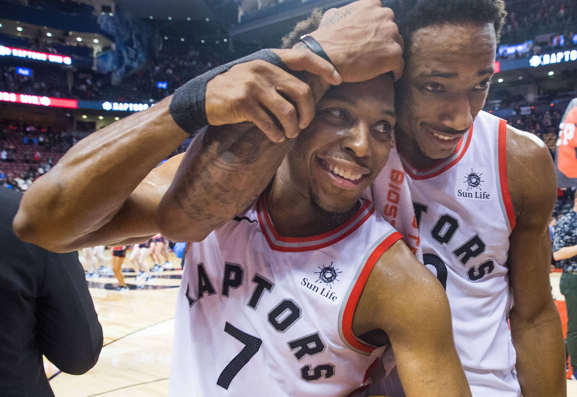 Kyle Lowry and DeMar Derozan hugging while playing for the Toronto Raptors