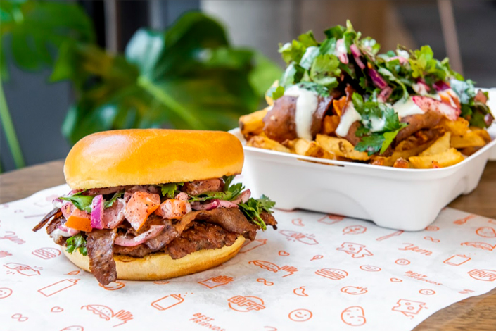 Burger and poutine on a table