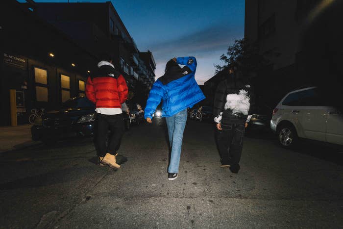People wearing The North Face&#x27;s limited edition Nuptse puffer in red and blue