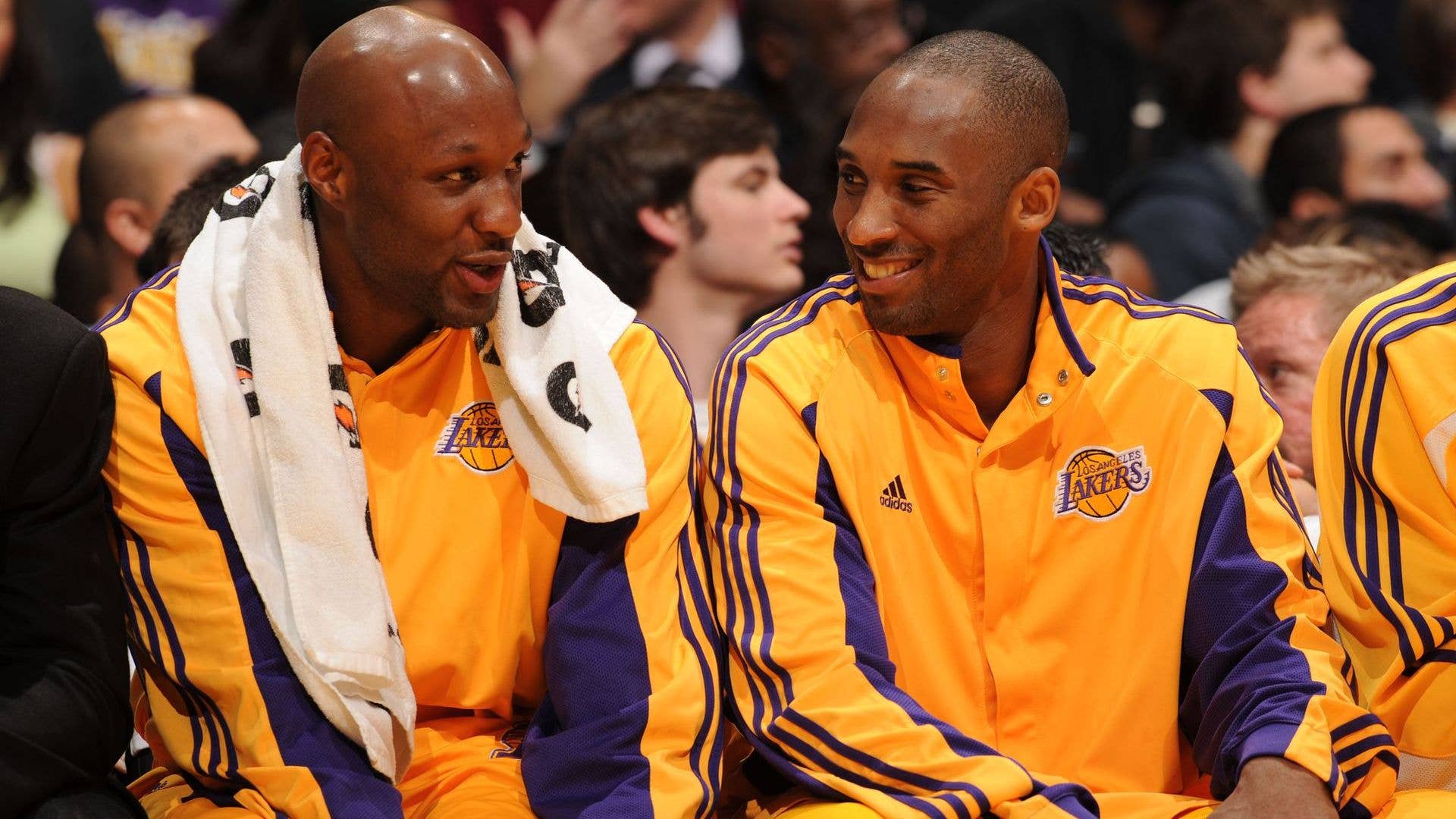 Lamar Odom and Kobe Bryant sit courtside in 2009