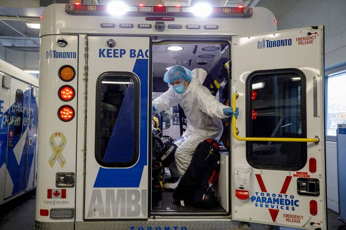 Paramedics and healthcare workers transfer a patient from Humber River Hospital&#x27;s Intensive Care Unit to a waiting air ambulance as the hospital frees up space In their ICU unit, in Toronto, Ontario, Canada, on April 28, 2021.