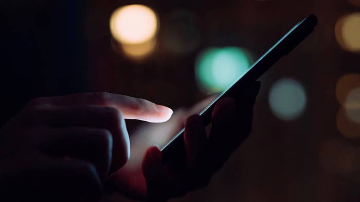 Close up of woman&#x27;s hand using smartphone