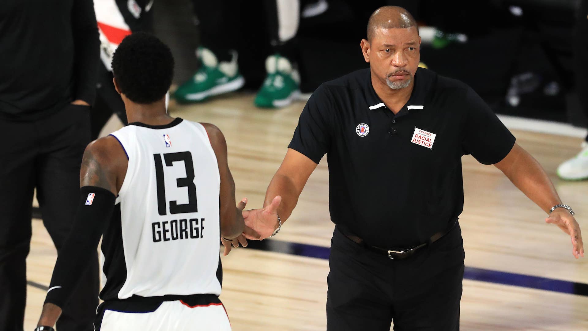 Doc Rivers of the LA Clippers reacts with Paul George #13 of the LA Clippers