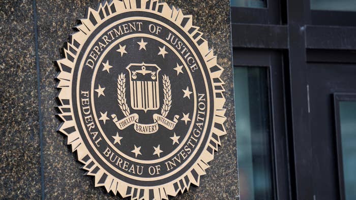 A logo for the DOJ and FBI is pictured