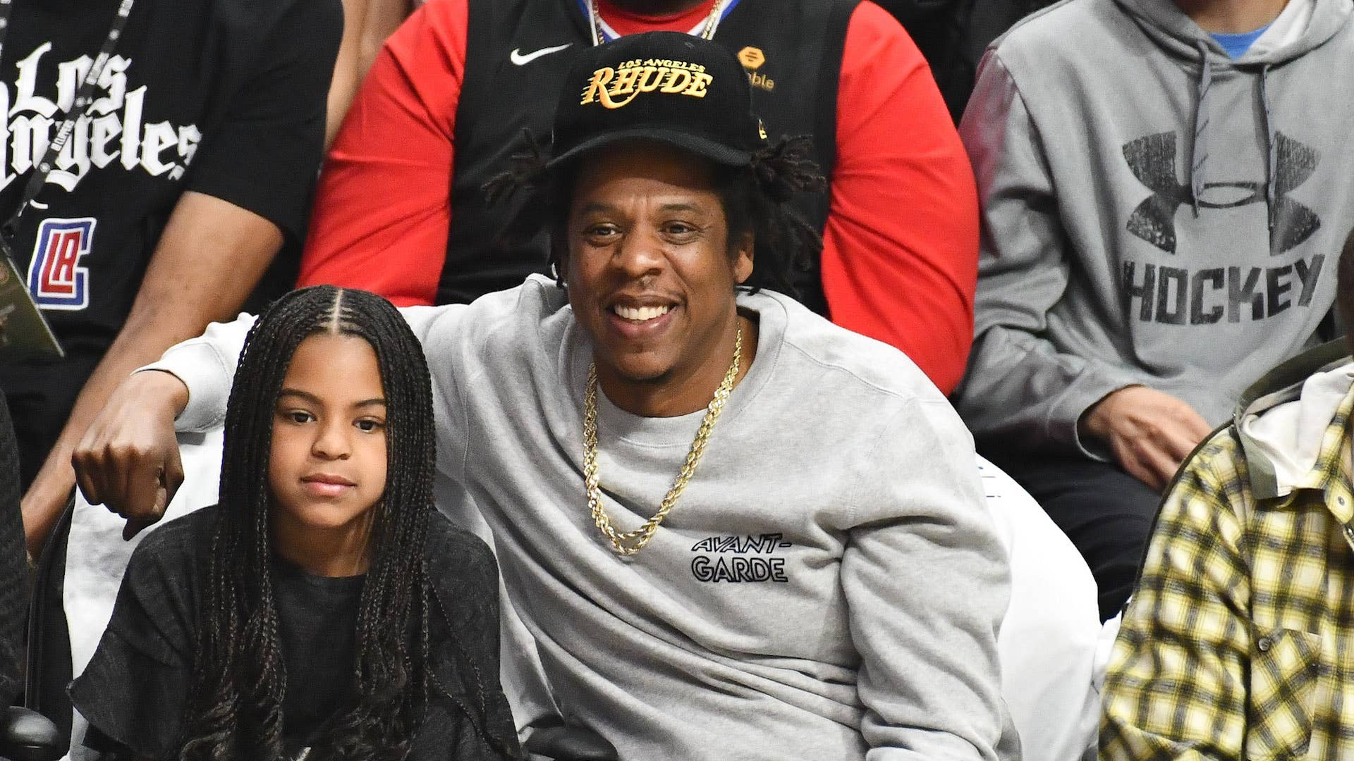 ay Z and Blue Ivy Carter attend a basketball game
