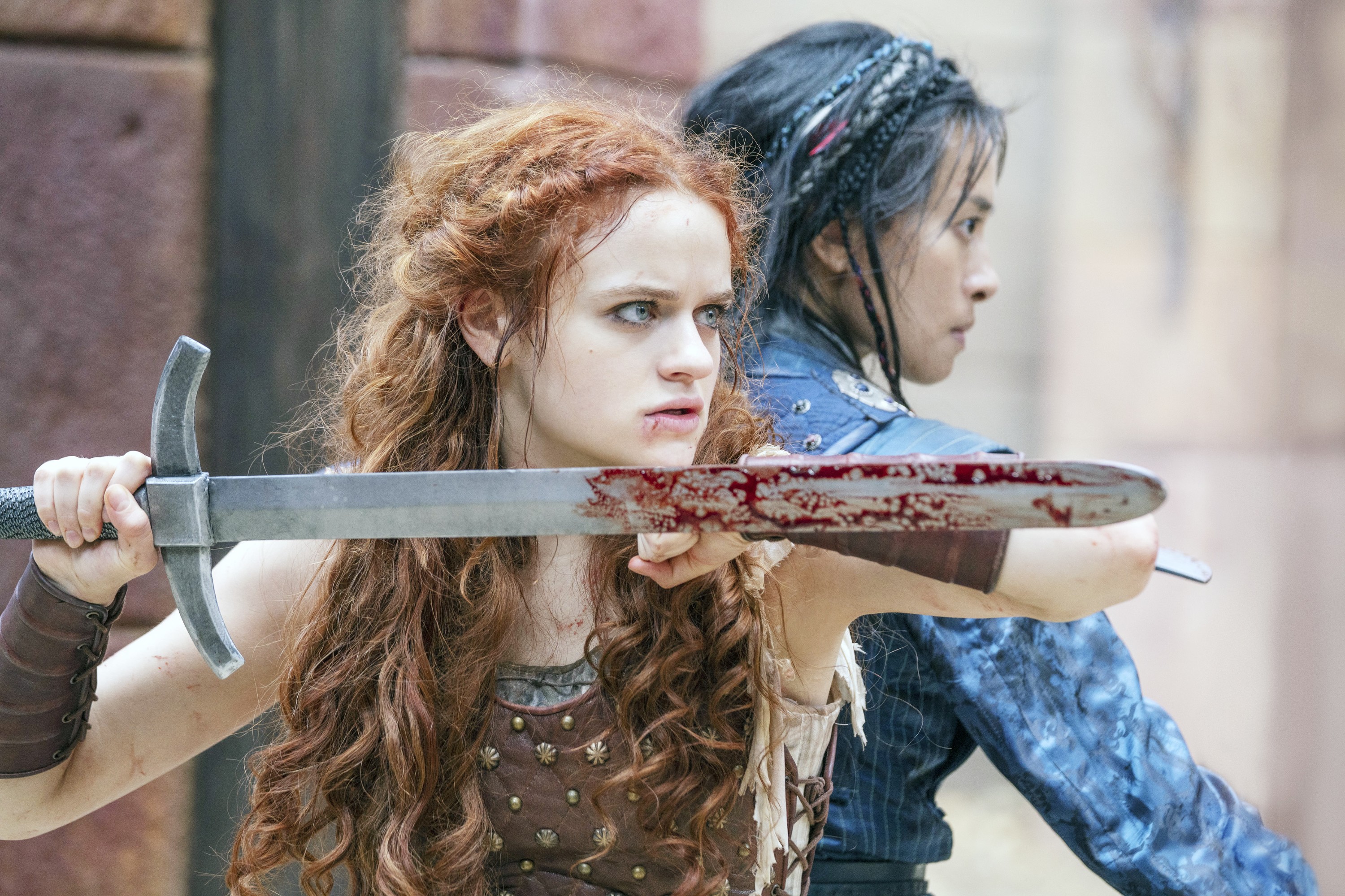 the princess joey king holds a bloody sword