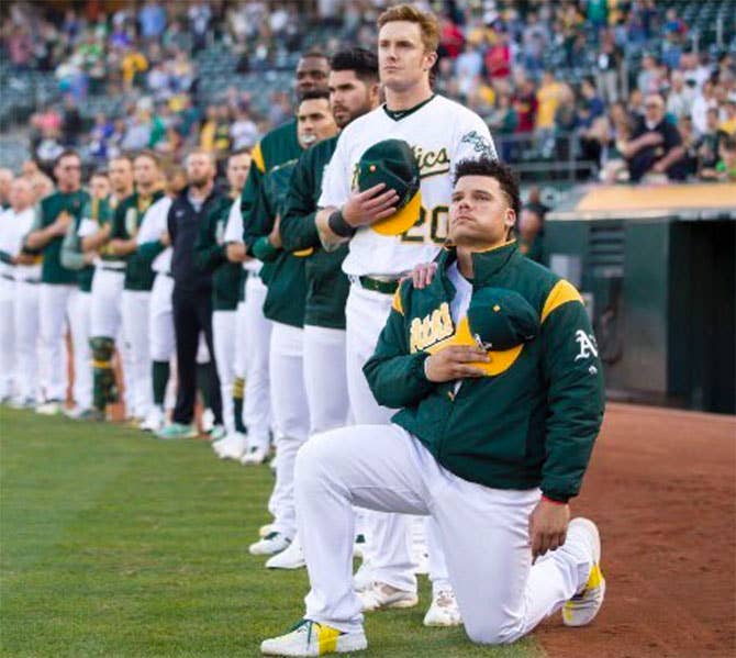 bruce maxwell kneeling during national anthem