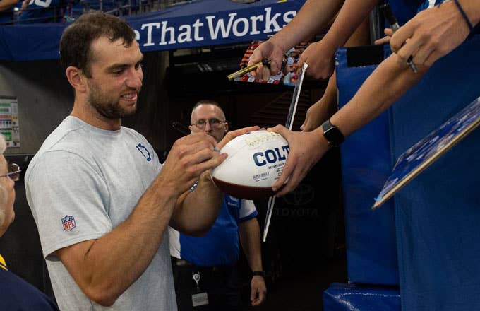 Andrew Luck signs autographs for Colts fans during the 2019 preseason.