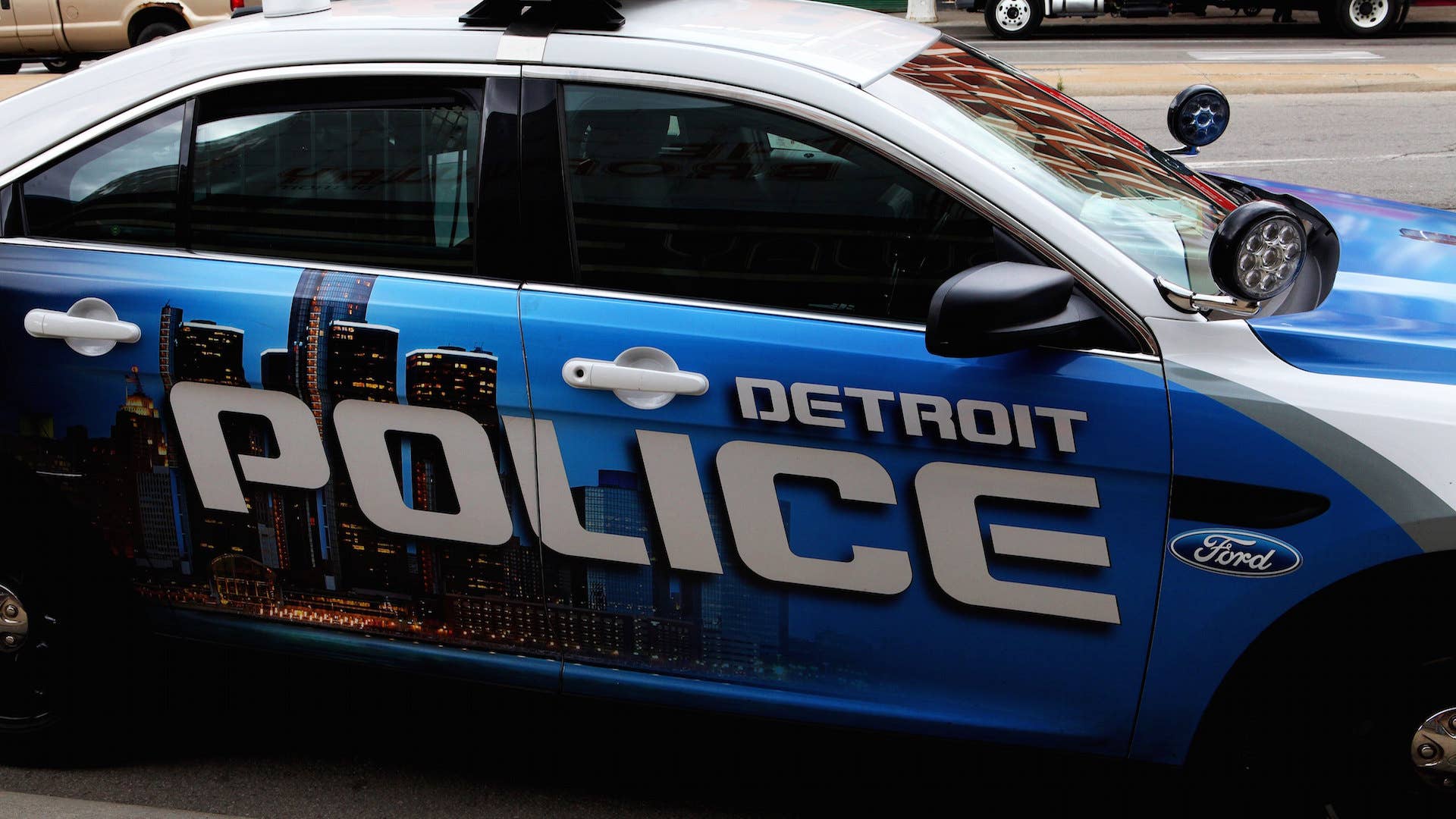A Detroit police car sits on a downtown street