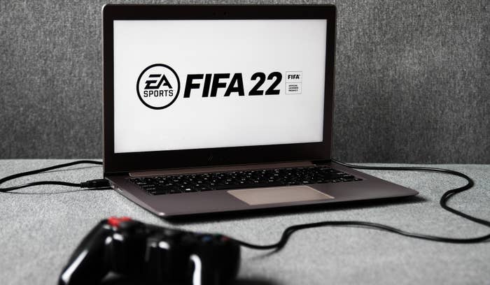 EA Sports&#x27; FIFA 22 logo displayed on a laptop screen