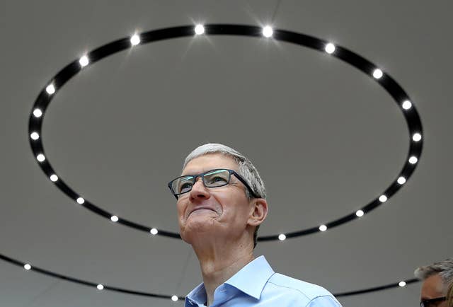 Apple CEO Tim Cook looks on during an Apple special event at the Steve Jobs Theatre